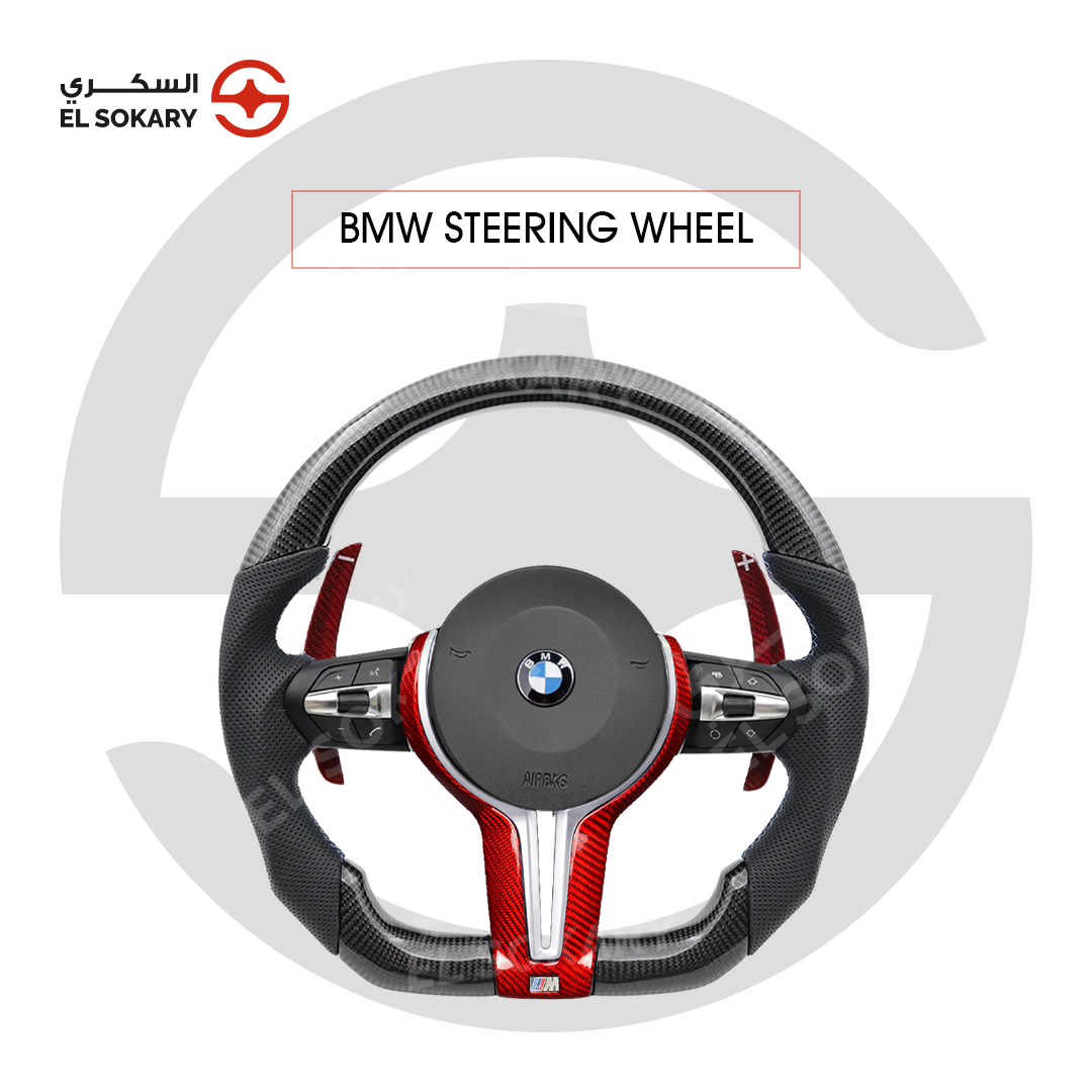 BMW 3 Series E90 (2005-2011) BMW 3 Series E90 A custom BMW M style flat-bottom steering wheel featuring black carbon fiber, perforated leather side grips, vibrant red carbon fiber center trim accents, extended red paddle shifters, and multi-function control buttons centered on a white background with an El Sokary watermark.