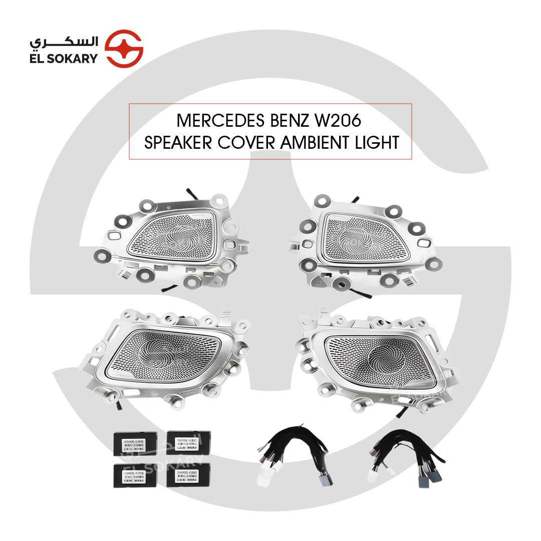 Four Mercedes-Benz W206 Burmester-style perforated metallic speaker covers with integrated LED ambient lighting modules, wiring harnesses, and control boxes.