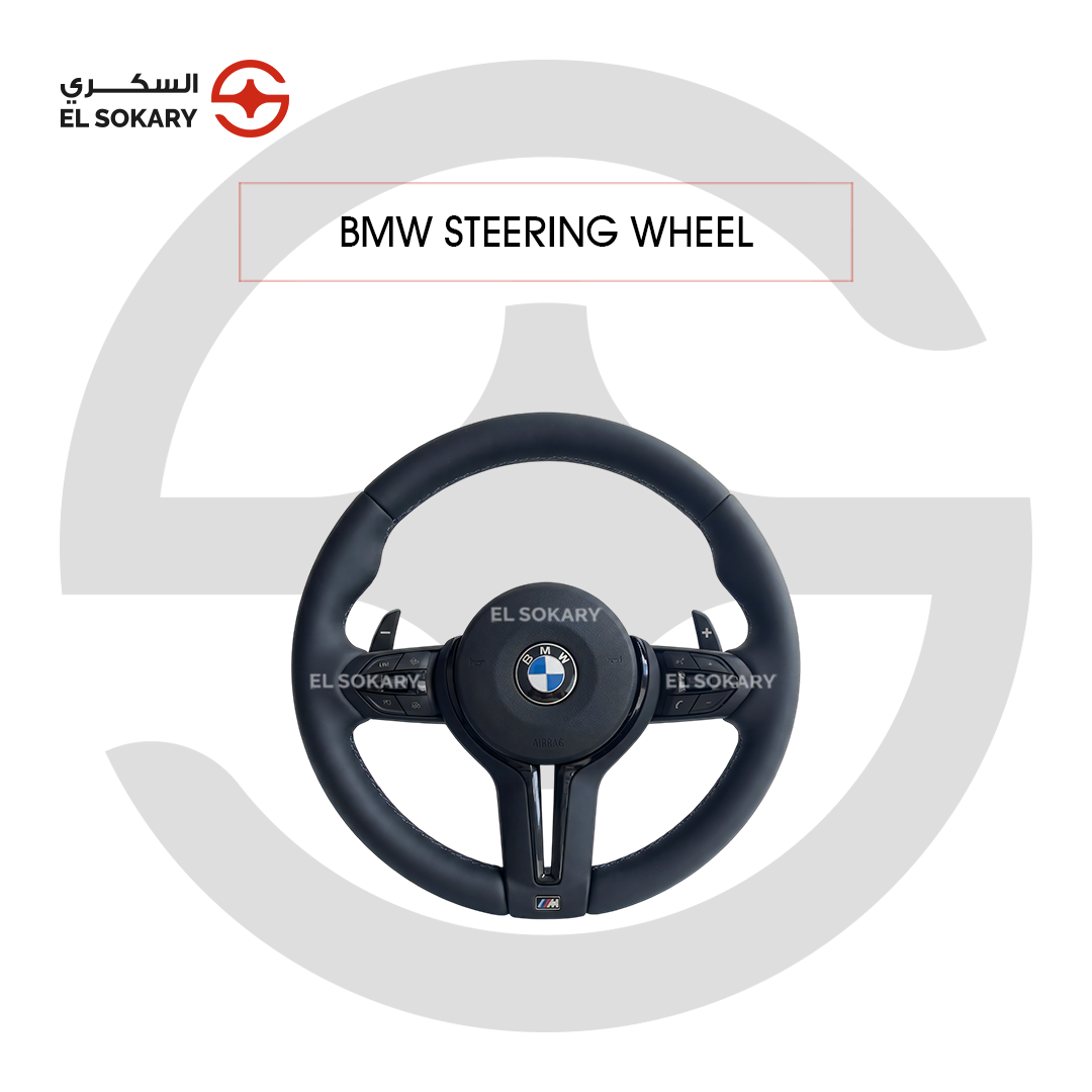 BMW 5-Series E39 Upgraded monochromatic stealth M Sport multifunction steering wheel with black paddle shifters installed in a premium BMW cabin.