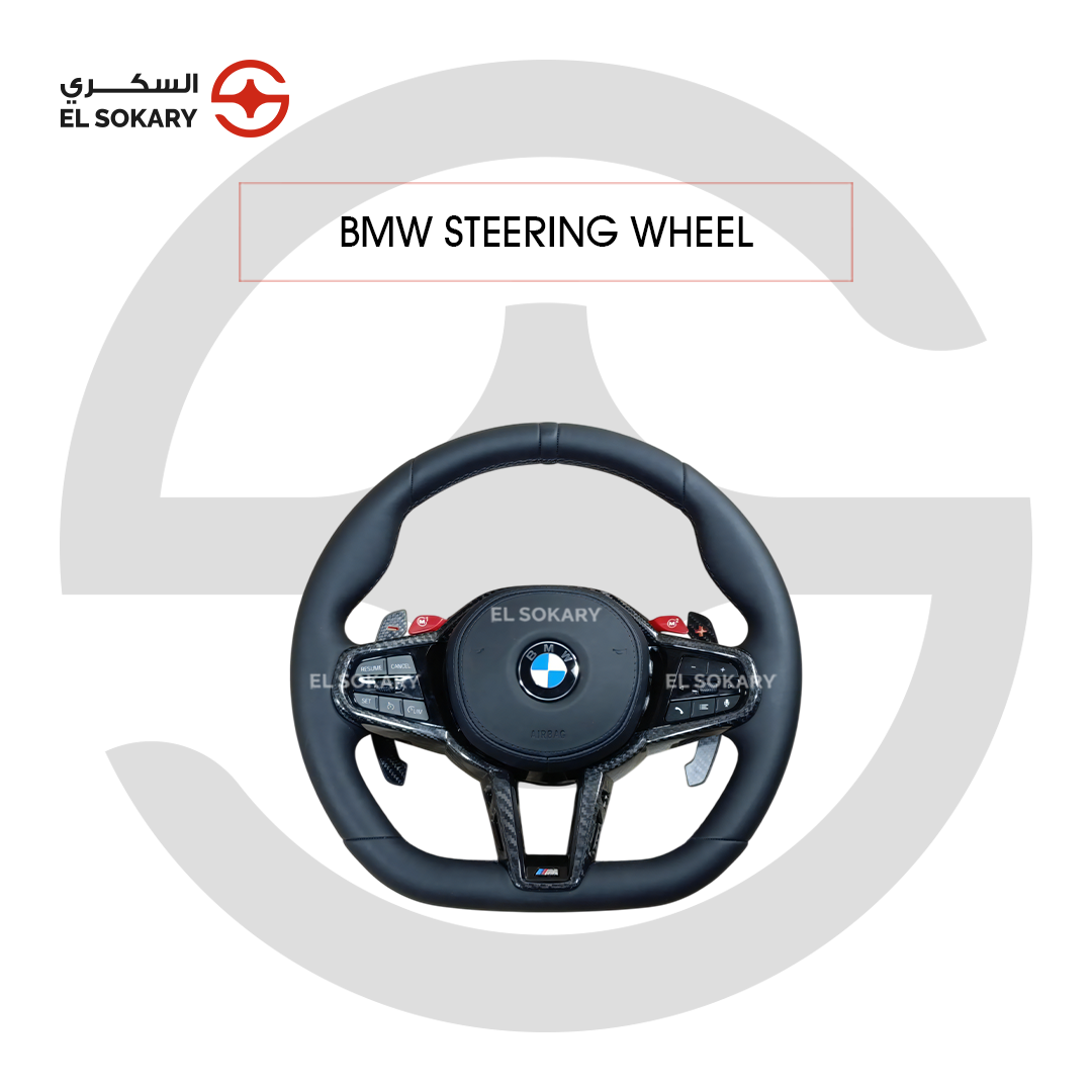 BMW 7-Series F01/F02 A custom BMW M CS style steering wheel in smooth black leather, featuring high-gloss carbon fiber center trim, integrated paddle shifters, prominent red M1 and M2 mode buttons, multi-function control keypads, a small M logo at the base, and the central BMW emblem, centered on a white background with an El Sokary watermark.